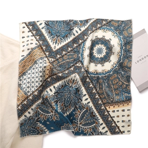 50cm square satin silk scarf featuring navy blue and gold paisley bohemian prints
