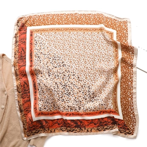 Classic leopard print silk scarf with orange borders and smooth satin texture for women