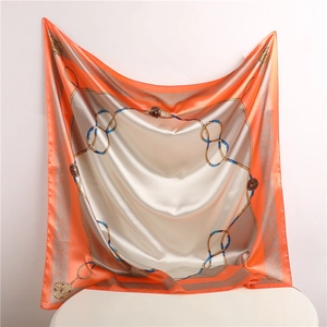 Detail of 90x90cm silk scarf showing nautical chain patterns and vibrant orange borders