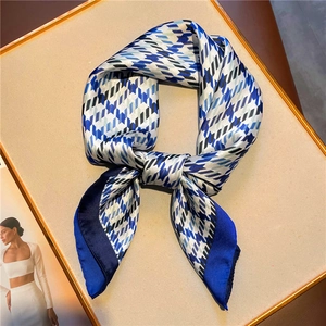Elegant houndstooth silk square scarf in navy and light blue with a stylish knot