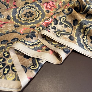 Detail showing vintage mandala print on silk scarf with elegant satin luster finish