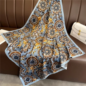 European vintage floral print silk scarf 90x90cm draped on a leather sofa