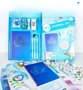 Blue DIY journal set showing washi tapes, stickers, pens, and notebook in a gift box