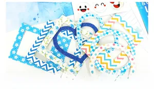 Detail view of colorful DIY paper frames with floral and geometric patterns for journaling