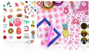 Detail shot of pink DIY journal set with stickers, washi tapes, highlighter and clips
