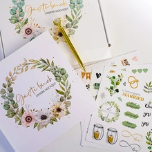 Gedetailleerde bruiloft gastenboek set met botanische krans en gouden diamant pen