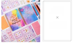 Detail view of colorful gradient journals with glitter stickers and heart-shaped clips