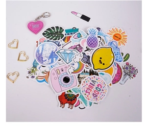 Flat lay of colorful cartoon waterproof stickers with flamingo and alpaca for DIY journals