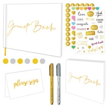 Wedding guest book set with gold lettering, metallic pens, and decorative heart stickers