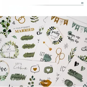 Close-up of wedding scrapbook stickers with heart, ring and soulmate lettering