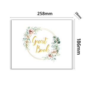 Floral wedding guest book with gold foil lettering and watercolor rose wreath design