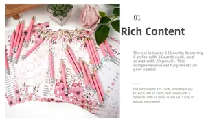 Flat lay of 125 floral baby shower game cards with 20 pink wooden pencils on white desk