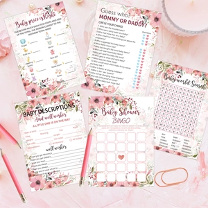 145-piece floral baby shower game set with bingo and wish cards on pink fabric