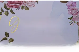 Detail of elegant gold foil lettering on a lavender floral wedding guest book cover