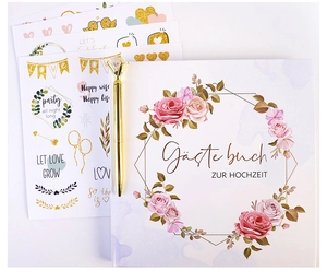 Detail of wedding guest book set with gold pen, floral cover and decorative stickers