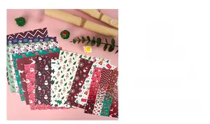 Detail view of 12 assorted Christmas scrapbook papers with festive holiday patterns