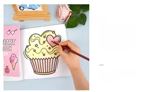 Detailed interior of coloring book showing cupcake designs with a red colored pencil