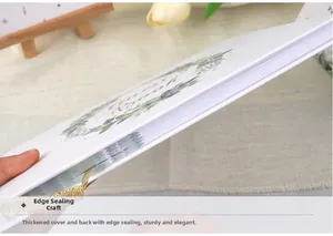 Detail showing the thick cover and edge binding craft of this elegant white guest book