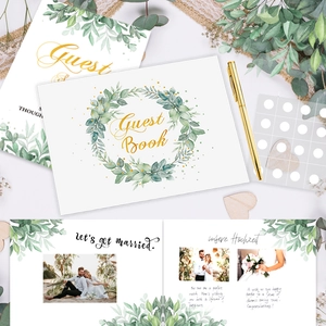 Wedding guest book set with gold pen and heart decorations featuring green leaf wreath design