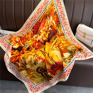 Detail of oil painting style silk scarf with abstract warm tones and floral border