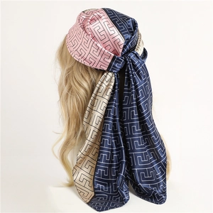 Satin silk scarf with geometric maze pattern in pink, navy, and champagne color blocking