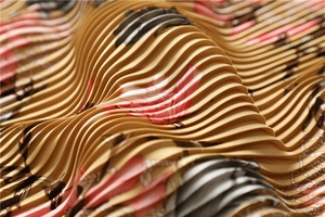 Macro shot of pleated silk scarf fabric with yellow floral patterns and fine textures