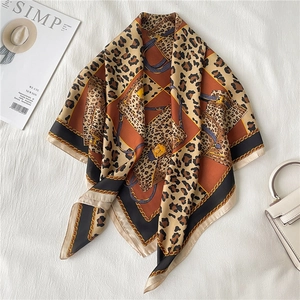 Elegant emerald green silk scarf with leopard print and golden chain pattern for women