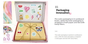 Detail of DIY journal kit stickers and gift packaging with pink box and kraft paper