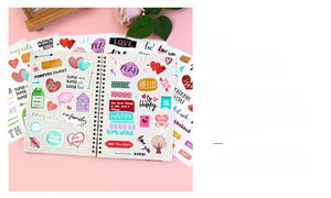 Close-up of decorative vinyl stickers with family themes on a creative planner page