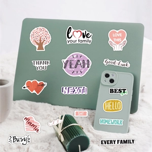 Waterproof vinyl stickers with family themes on a laptop and phone for scrapbook decor