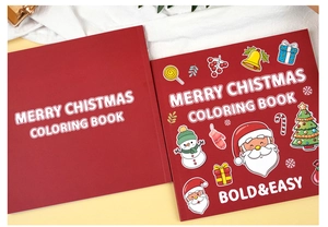 Gros plan sur deux cahiers de coloriage de Noël rouges avec des illustrations de dessins animés