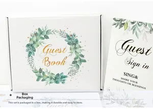 Detail of white wedding guest book set with gold foil lettering and floral wreath box