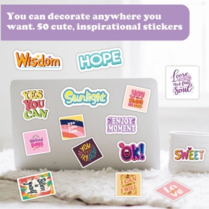 Detail of 50pcs waterproof vinyl stickers with motivational quotes on a laptop