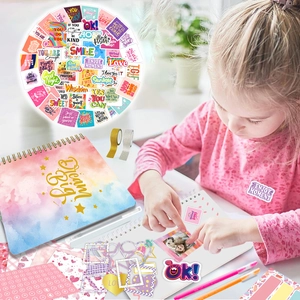 DIY scrapbook kit with spiral notebook stickers and glitter tape for creative kids crafting