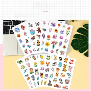 Detail of waterproof cartoon stickers featuring animal and mermaid themes for laptops
