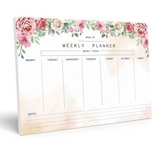 Weekly planner notepad featuring floral design with daily sections and focus area
