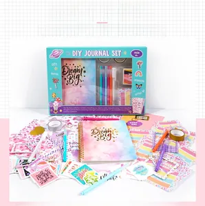 Detailed view of DIY scrapbooking kit including notebook, colorful pens and stickers