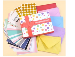Detailed view of birthday card set with assorted colorful envelopes and gold foil stickers