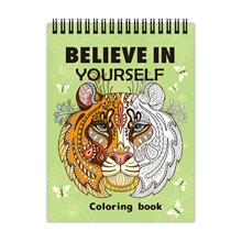 Close-up of spiral-bound coloring book with tiger cover and Believe in Yourself text