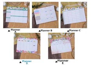 Detail view of weekly planner pads with floral and geometric patterns and section layouts