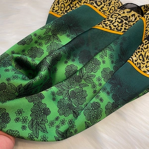 Elegant green floral square scarf with leopard print borders and vibrant orange piping