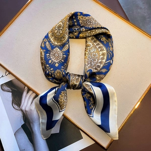 Elegant vintage paisley silk scarf in navy and gold, featuring classic floral patterns