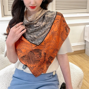 Detail of 110cm silk-like scarf featuring vintage orange and beige botanical patterns
