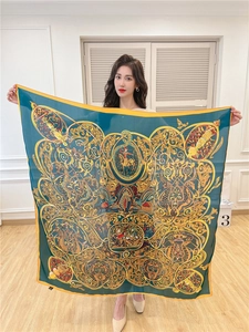 Detail of vintage emerald green silk square scarf with golden court floral patterns
