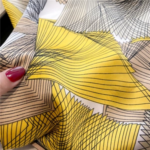 Macro detail of the smooth satin silk fabric with modern geometric line patterns