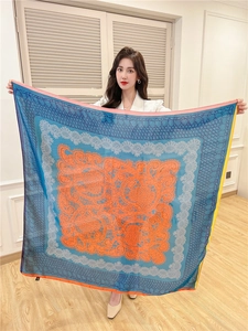 Detail of 110cm large silk scarf with vintage orange paisley prints and blue borders