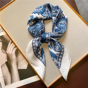 Elegant 70cm silk-like scarf with blue paisley pattern on a white display board