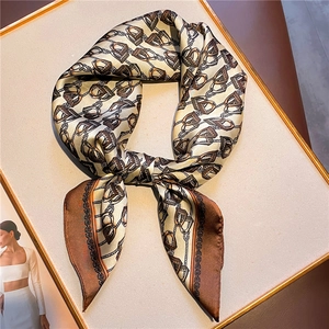 Elegant 70cm silk scarf featuring a vintage equestrian horse bit pattern in beige and coffee