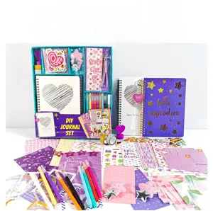 Detail of DIY journal set with spiral notebooks, markers, and decorative stickers