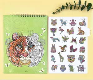 Macro view of animal coloring book with spiral binding and mandala tiger cover design